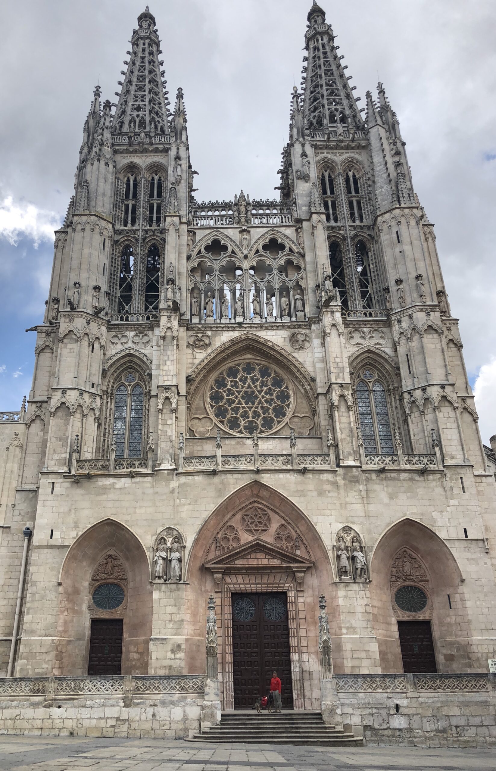 Feeling like ants beneath the towering walls of Burgos Cathedral
